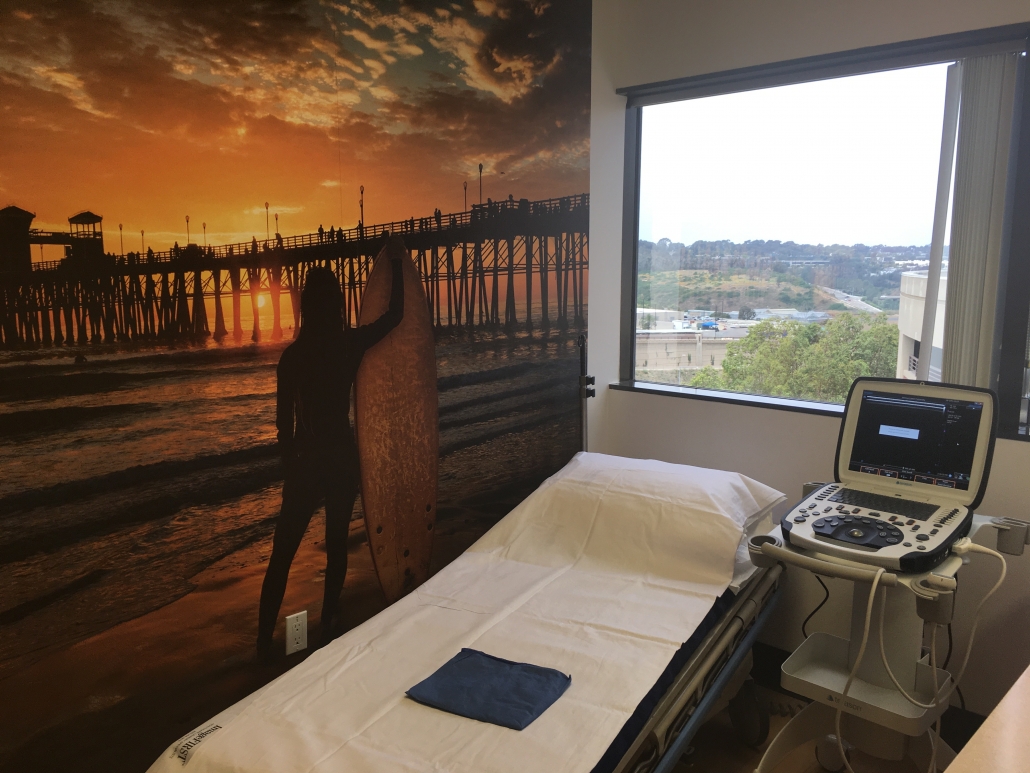 La Jolla Vein Care Treatment Room showing mural with pier and surfer